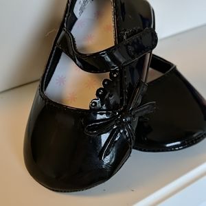 Black strap baby shoes